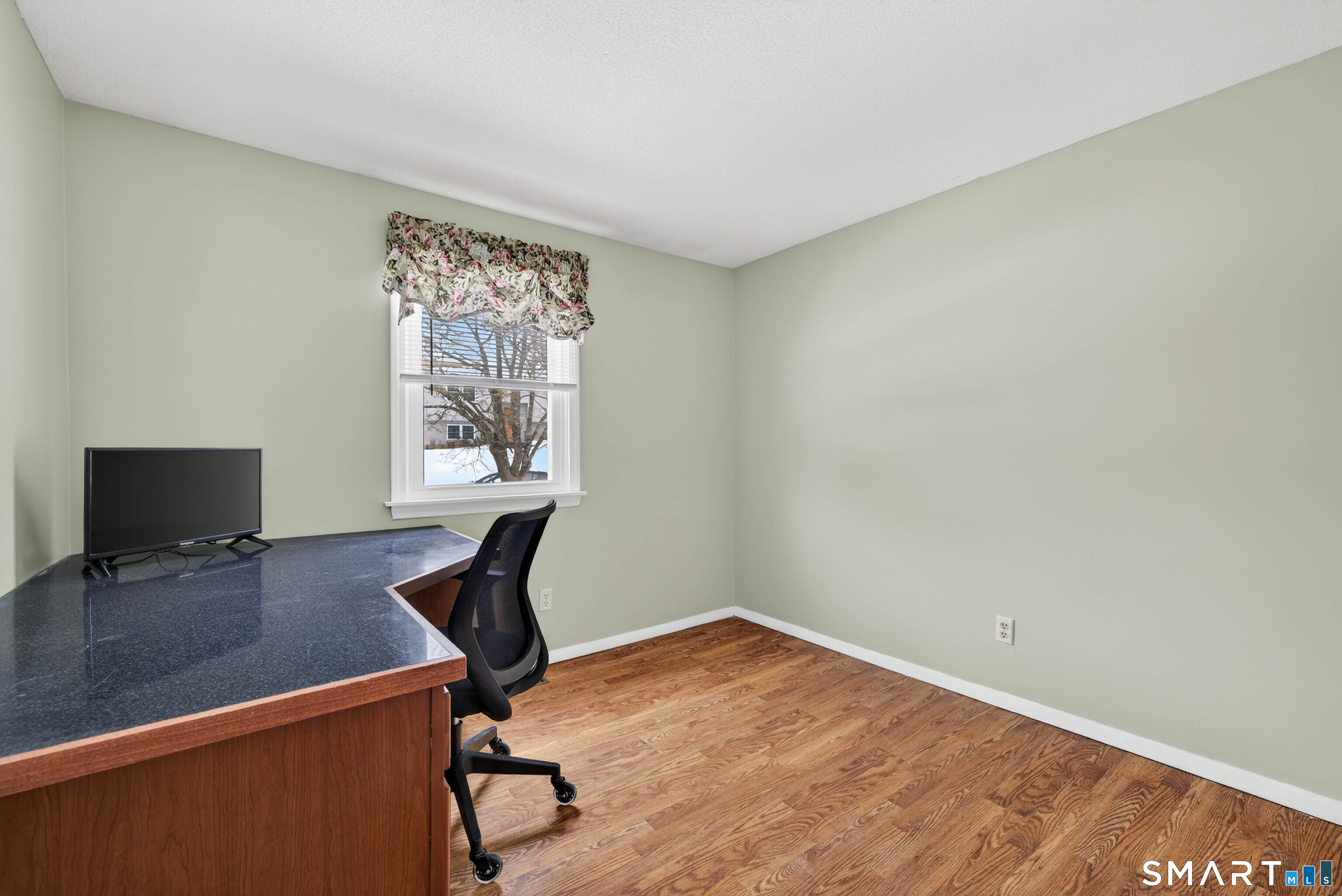 63 Spice Hill Drive Meriden, CT 06451 - Photo 11 of 30 a view of a workspace with furniture and a window