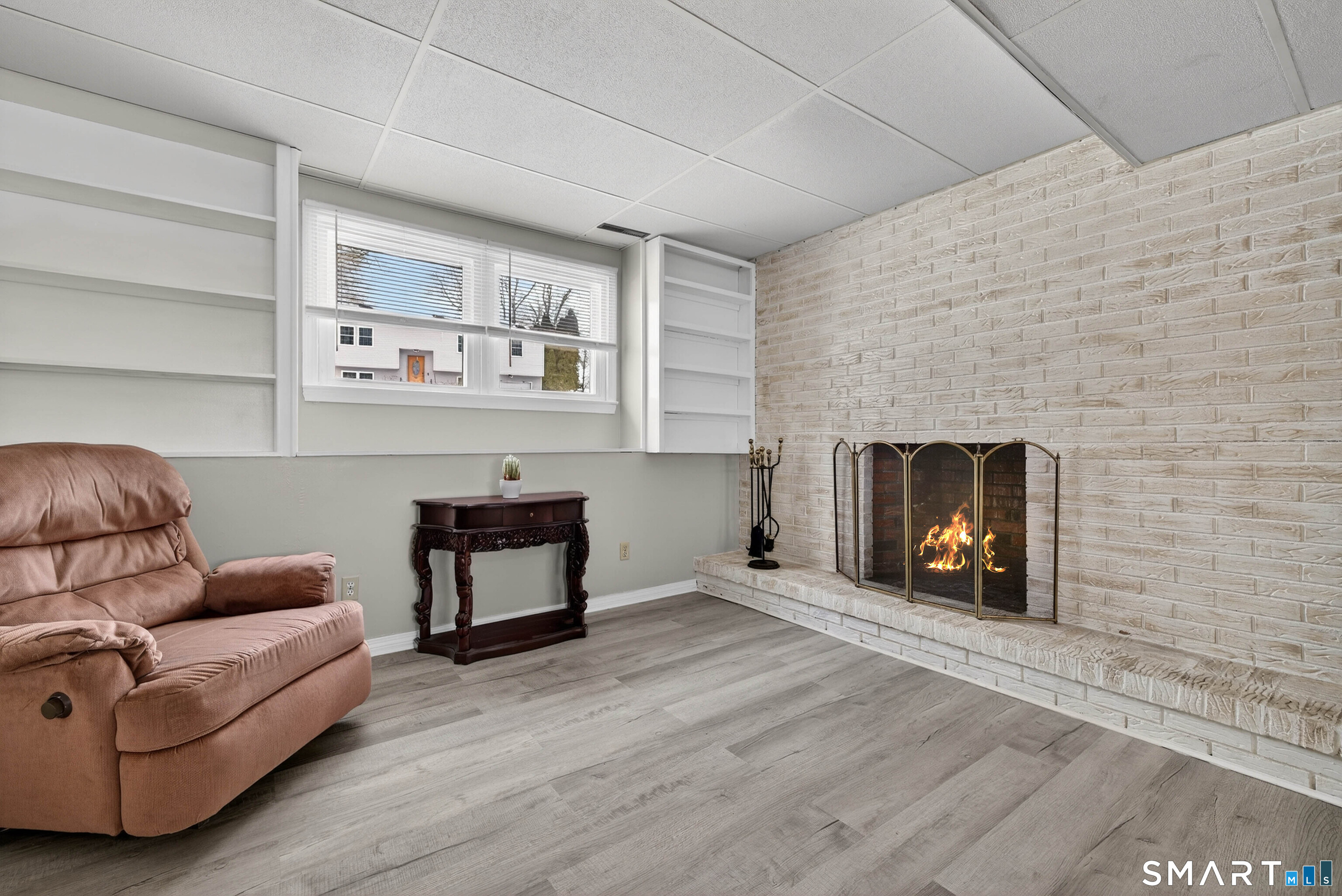 63 Spice Hill Drive Meriden, CT 06451 - Photo 17 of 30 a living room with furniture and a fireplace