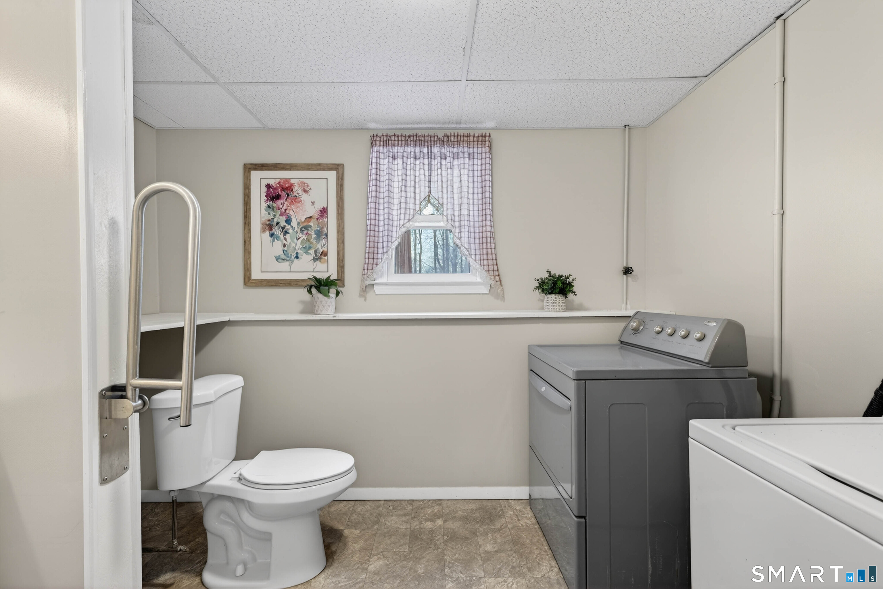 63 Spice Hill Drive Meriden, CT 06451 - Photo 20 of 30 a bathroom with a toilet sink and mirror