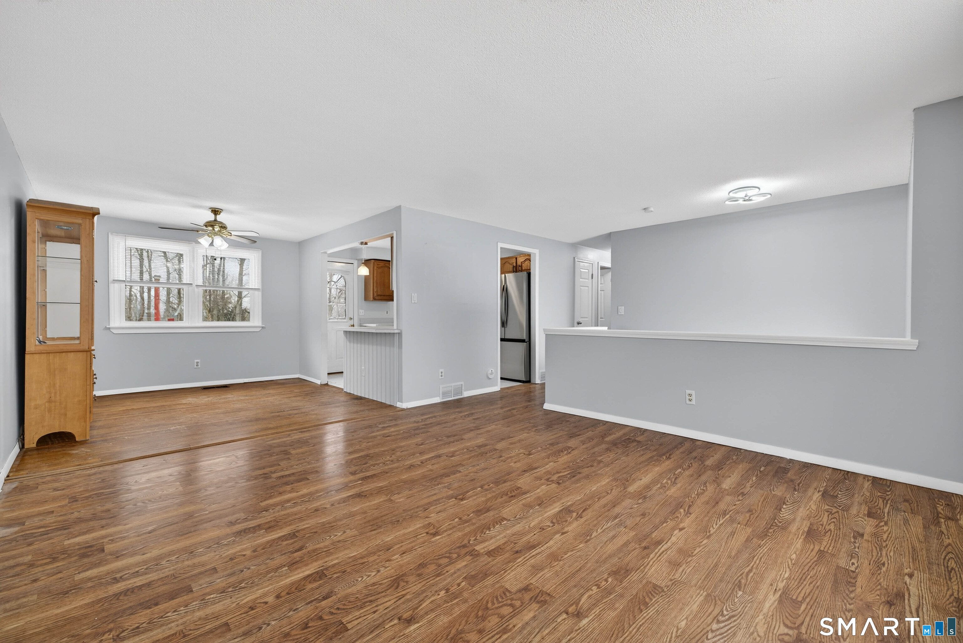63 Spice Hill Drive Meriden, CT 06451 - Photo 2 of 30 a view of empty room with wooden floor and window