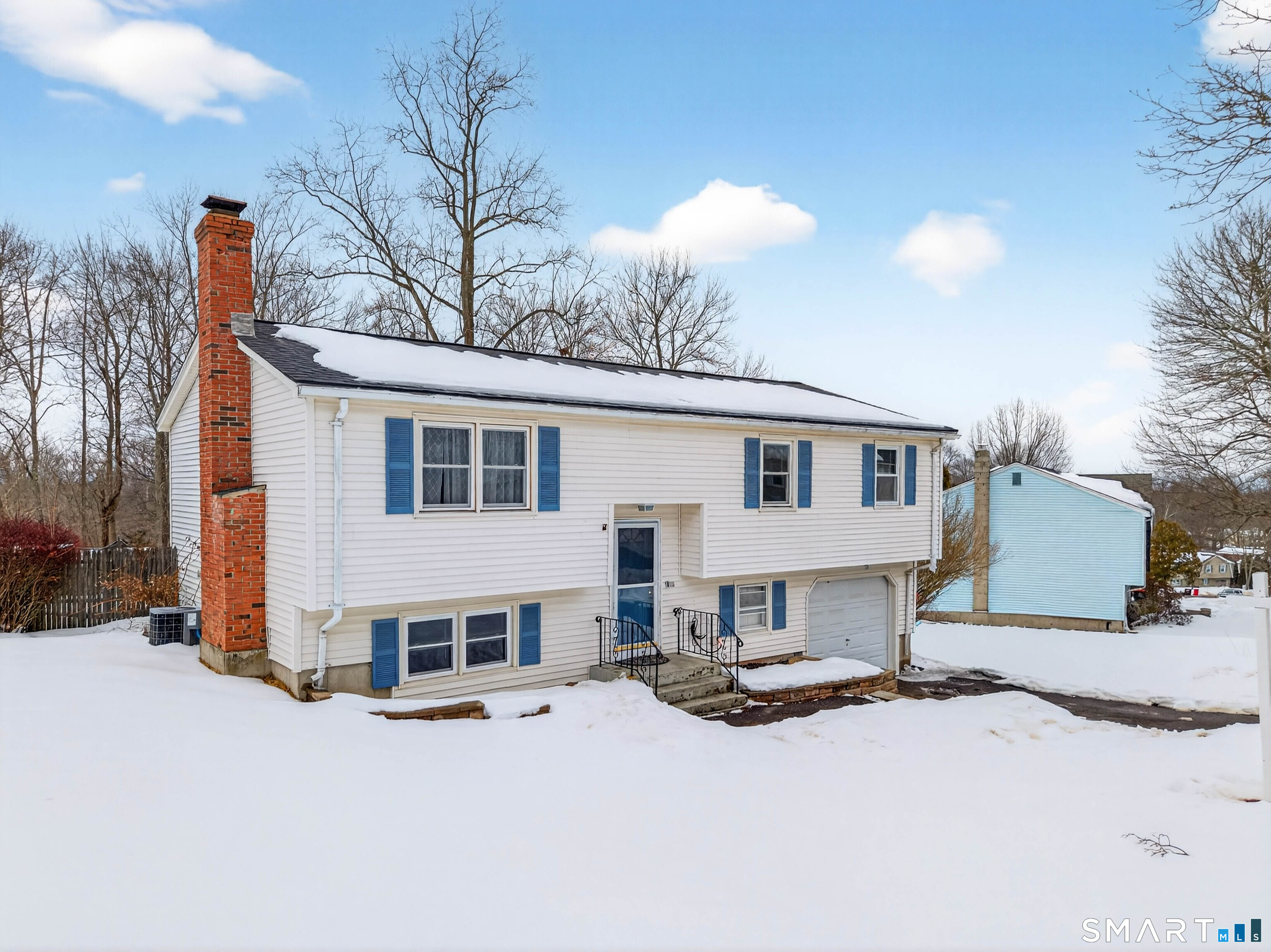 63 Spice Hill Drive Meriden, CT 06451 - Photo 26 of 30 a view of a house with wooden roof and sitting area
