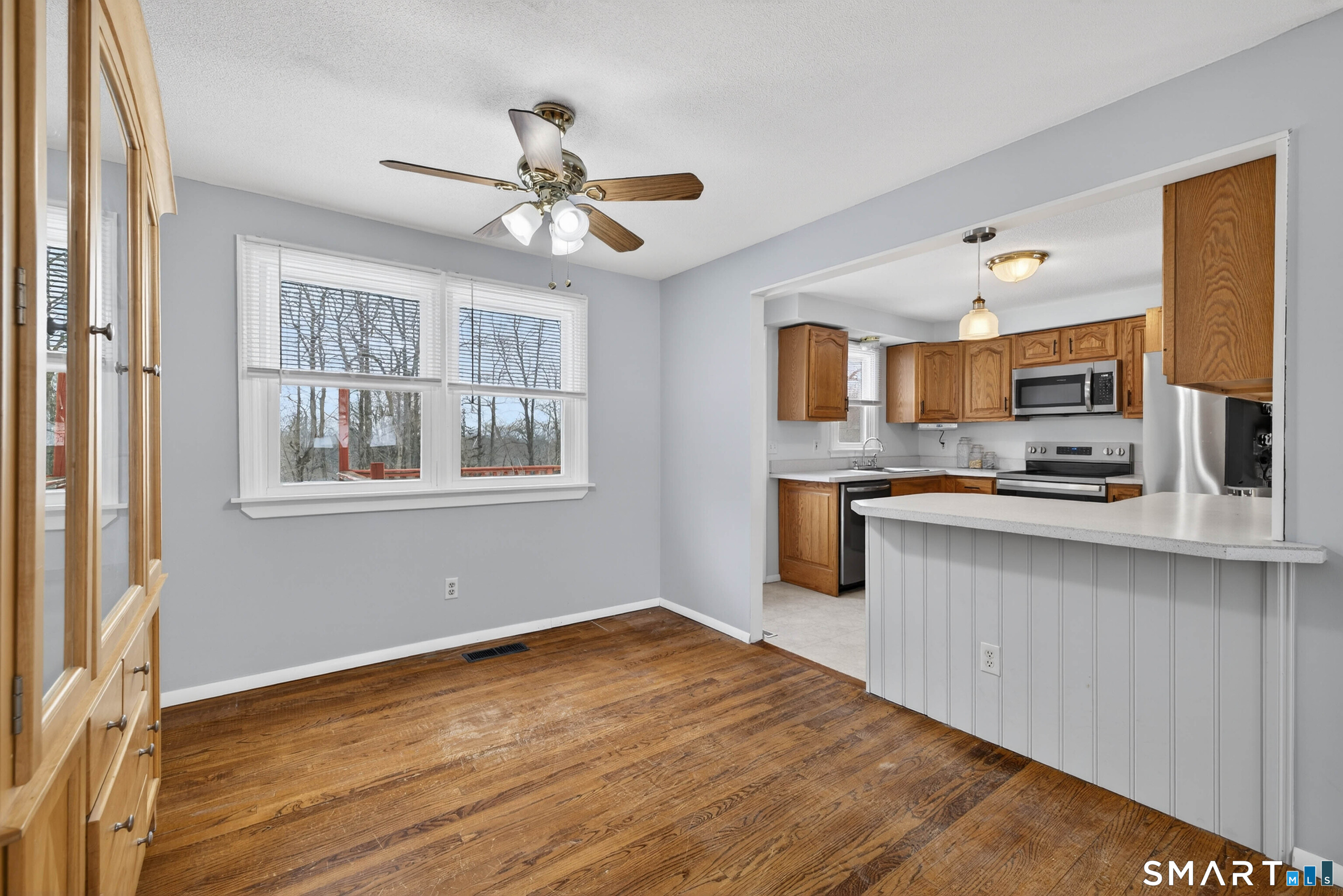 63 Spice Hill Drive Meriden, CT 06451 - Photo 6 of 30 a kitchen with granite countertop a stove cabinets and wooden floor