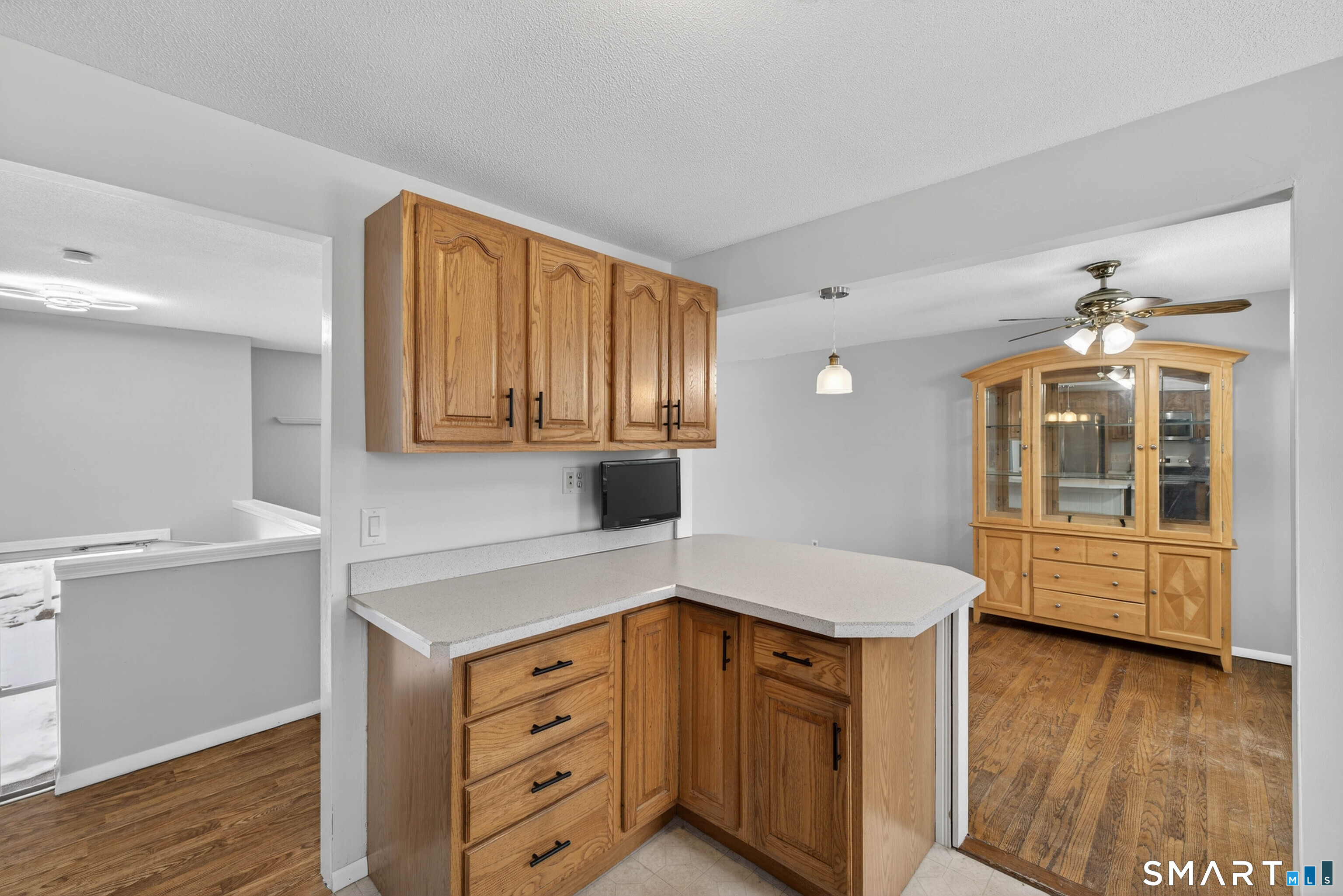 63 Spice Hill Drive Meriden, CT 06451 - Photo 7 of 30 a kitchen with a refrigerator a sink and cabinets