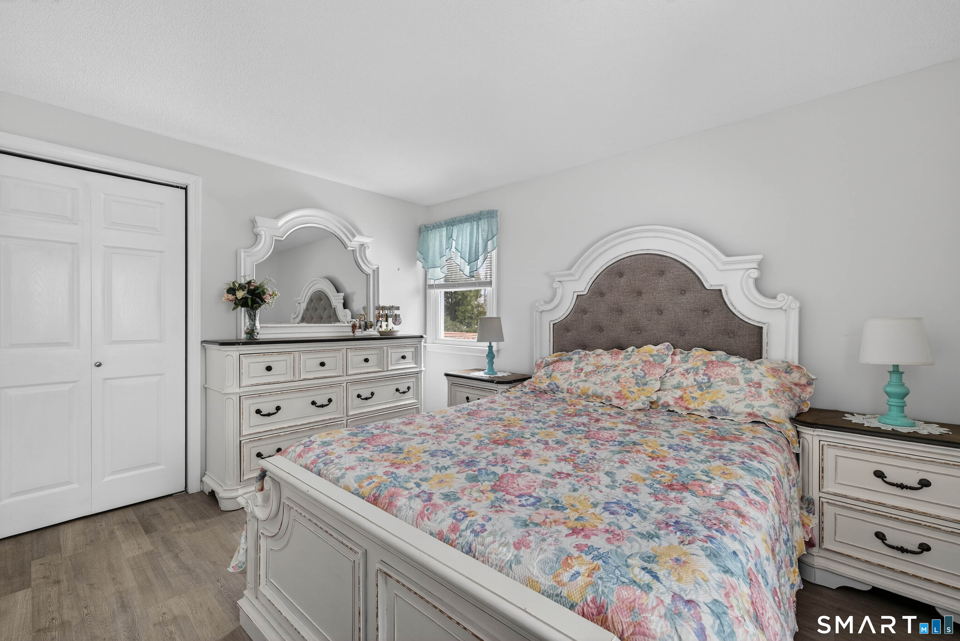 63 Spice Hill Drive Meriden, CT 06451 - Photo 8 of 30 a bedroom with a bed and a dresser