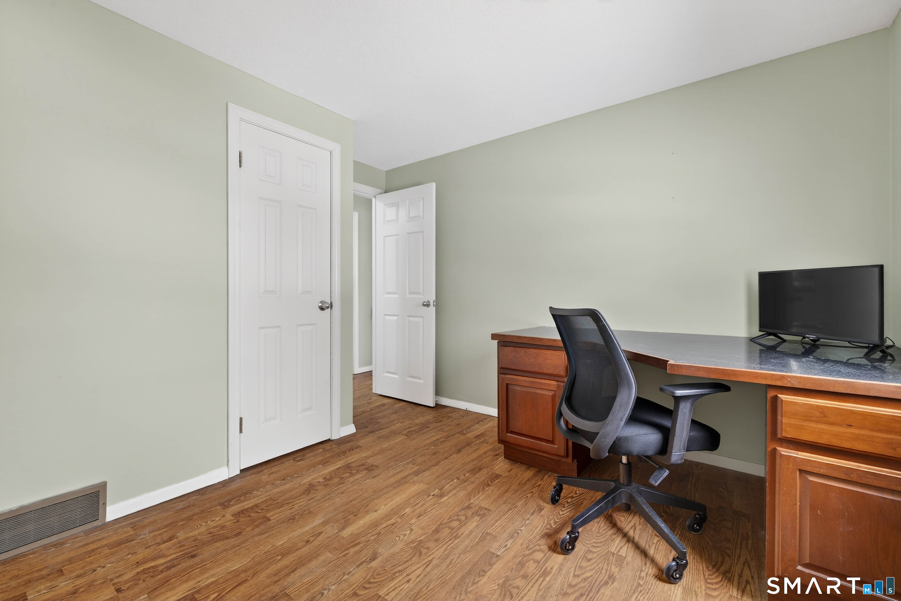 63 Spice Hill Drive Meriden, CT 06451 - Photo 10 of 30 a view of a workspace with furniture and wooden floor