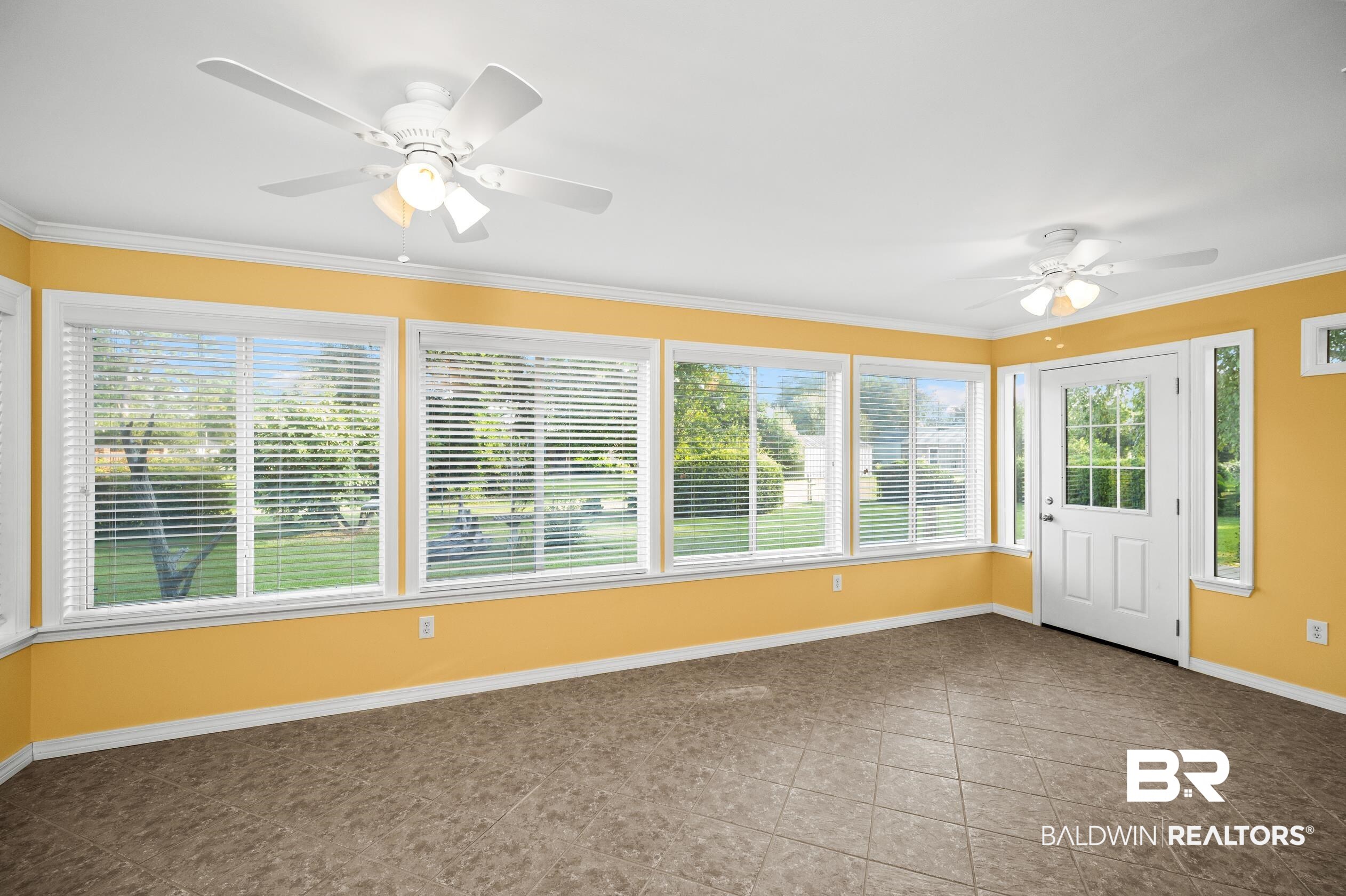 303 West Palm Avenue Foley, AL 36535 - Photo 9 of 32 Unfurnished sunroom featuring ceiling fan