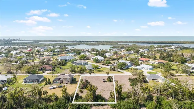 an aerial view of residential building with parking space