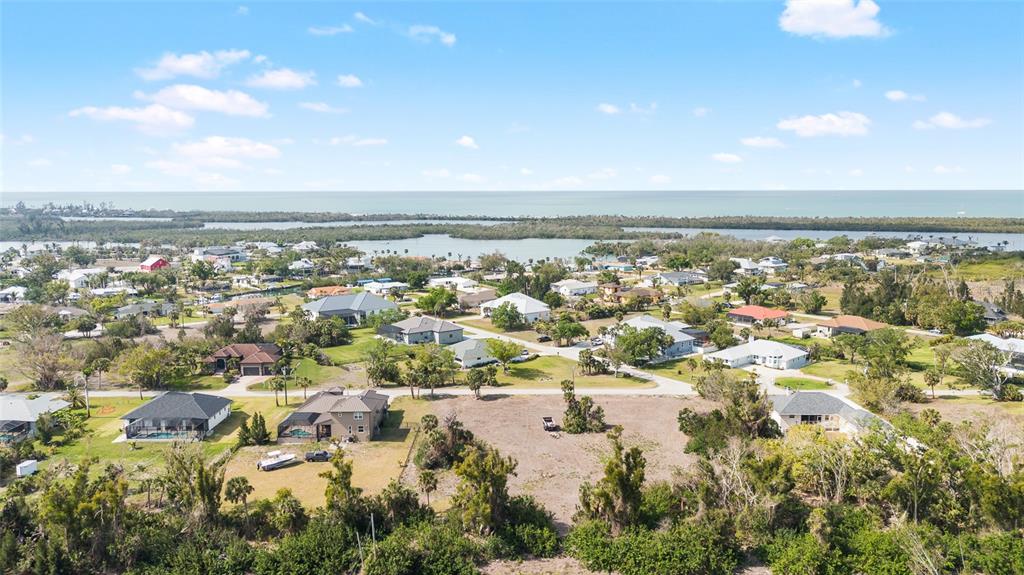 70 Spaniards Road Placida, FL 33946 - Photo 11 of 21 an aerial view of residential building and lake
