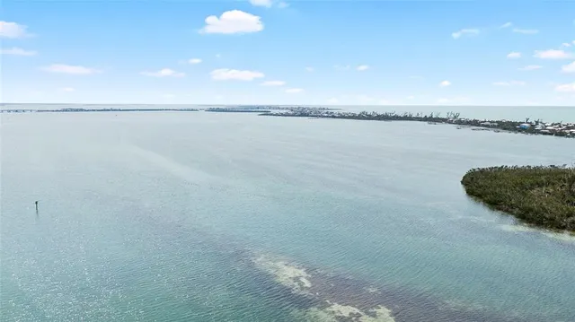 an aerial view of residential building with ocean view