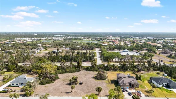 an aerial view of residential building and lake