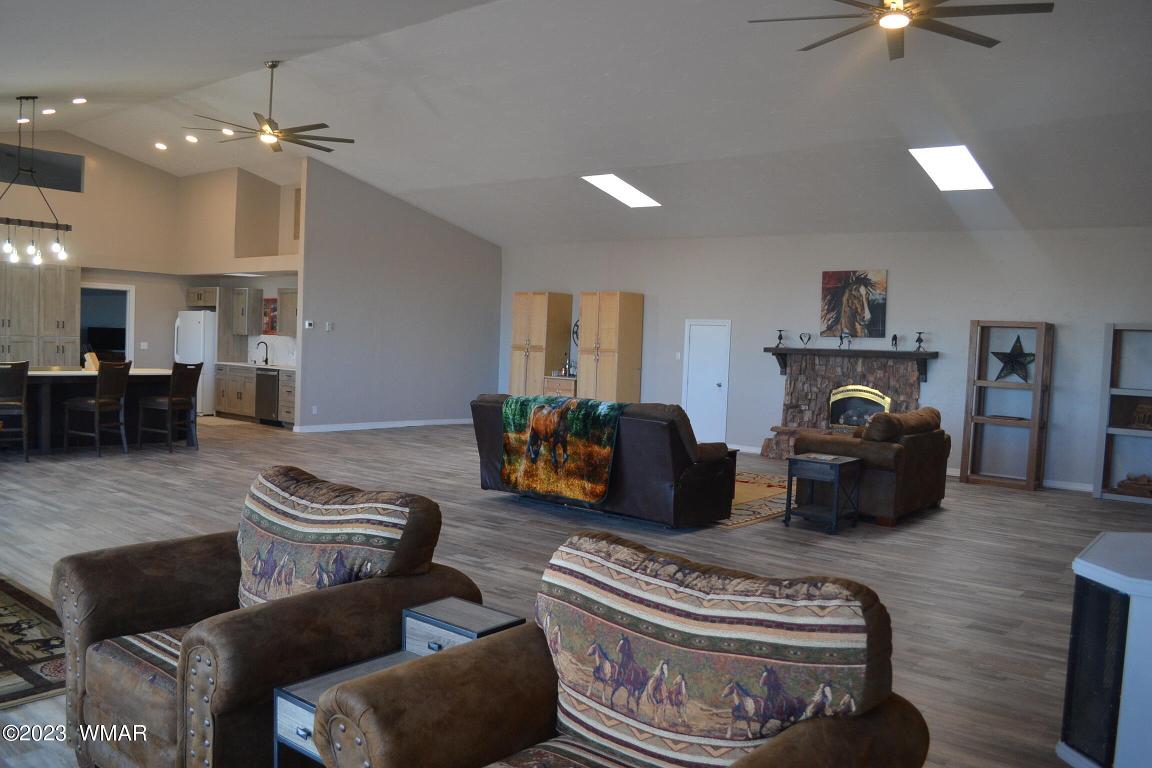5661 Valley Road Snowflake, AZ 85937 - Photo 14 of 55 a living room with furniture a rug and kitchen view