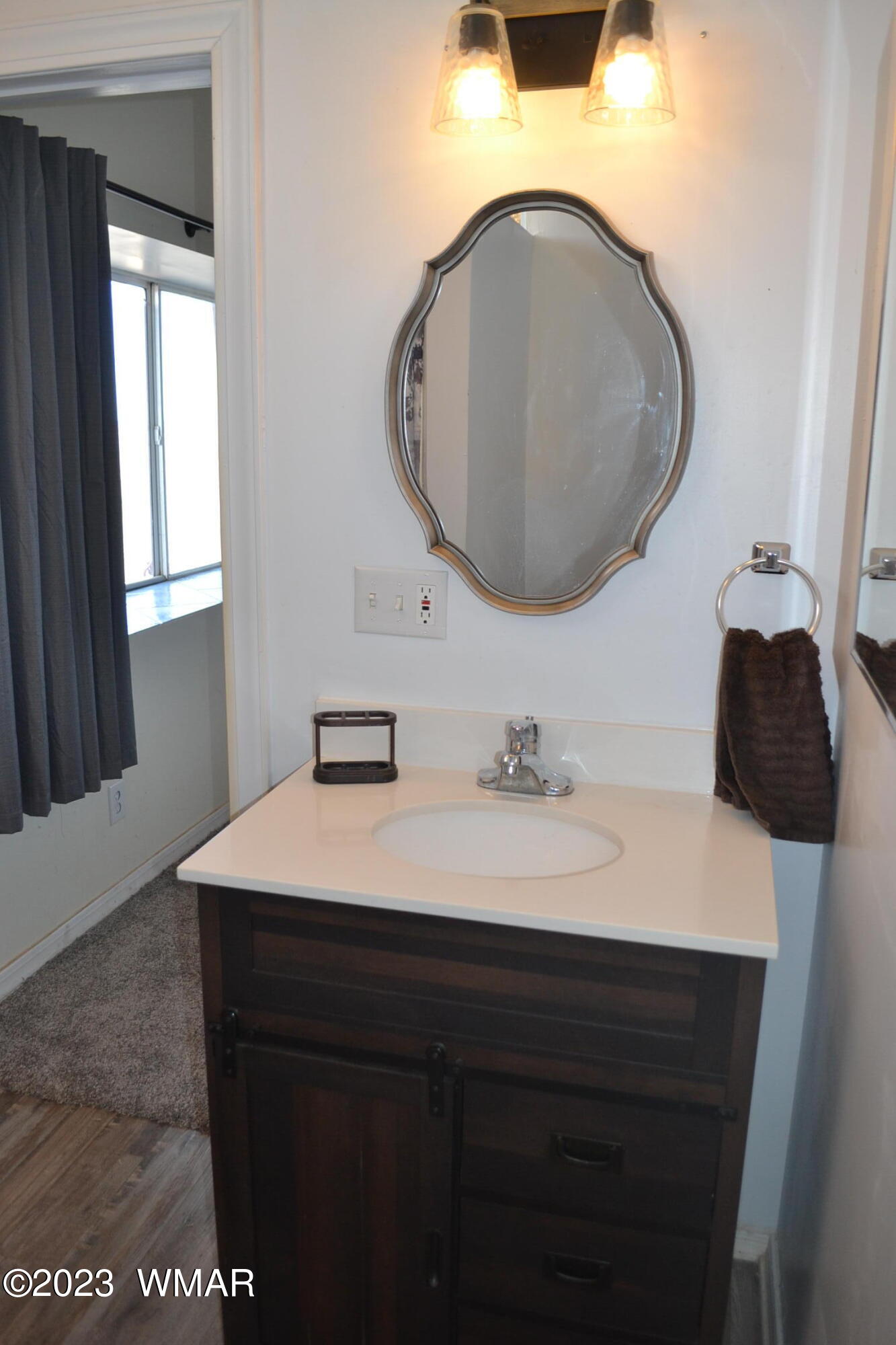 5661 Valley Road Snowflake, AZ 85937 - Photo 24 of 55 a bathroom with a sink and a mirror