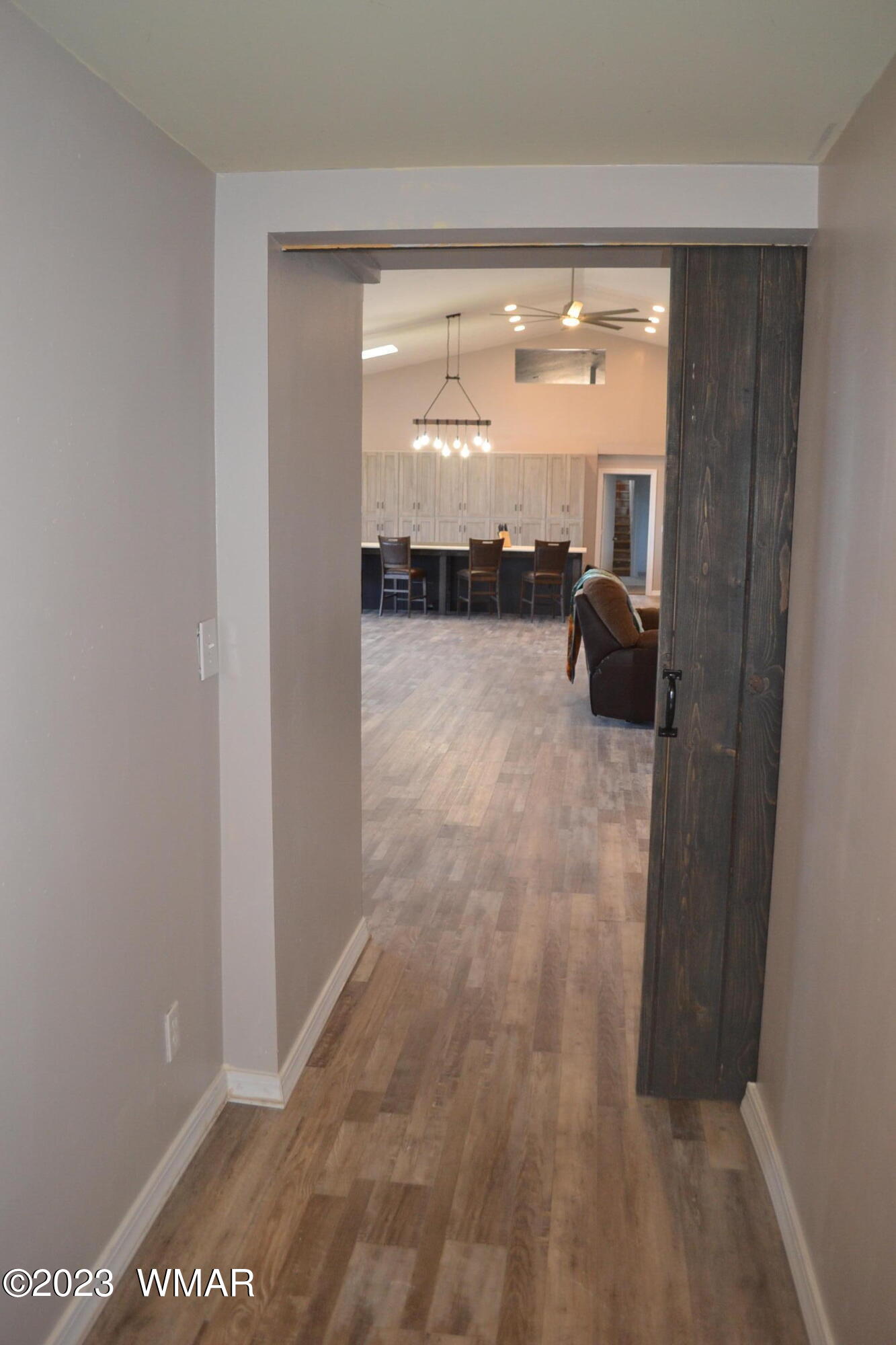 5661 Valley Road Snowflake, AZ 85937 - Photo 37 of 55 a view of a room with wooden floor and a floor to ceiling window