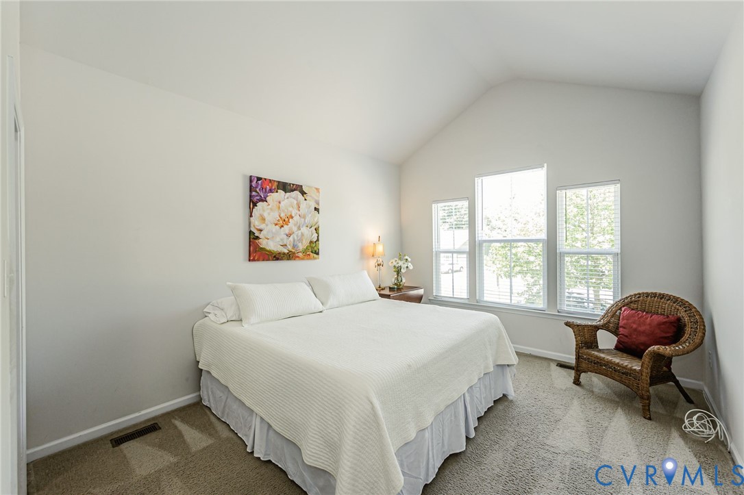 7435 Wicks Road Williamsburg, VA 23188 - Photo 52 of 82 Bedroom 2 with Vaulted ceiling bedroom with light