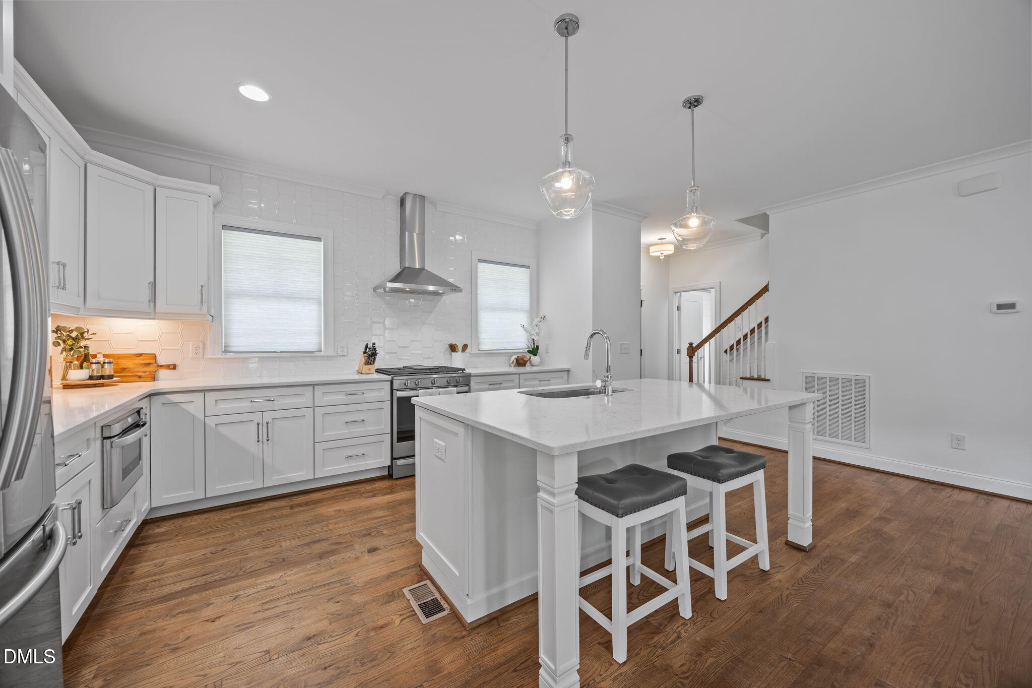804 Hartford Road Raleigh, NC 27610 - Photo 3 of 26 a kitchen with a table chairs sink and cabinets