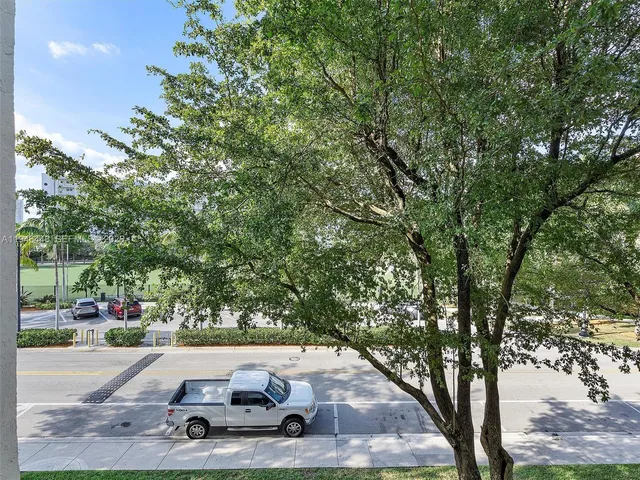 a view of a porch with a table and chairs