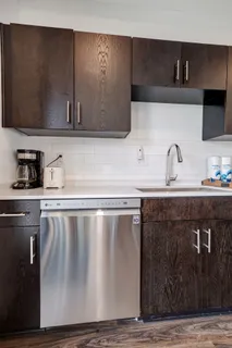 a kitchen with a sink and cabinets