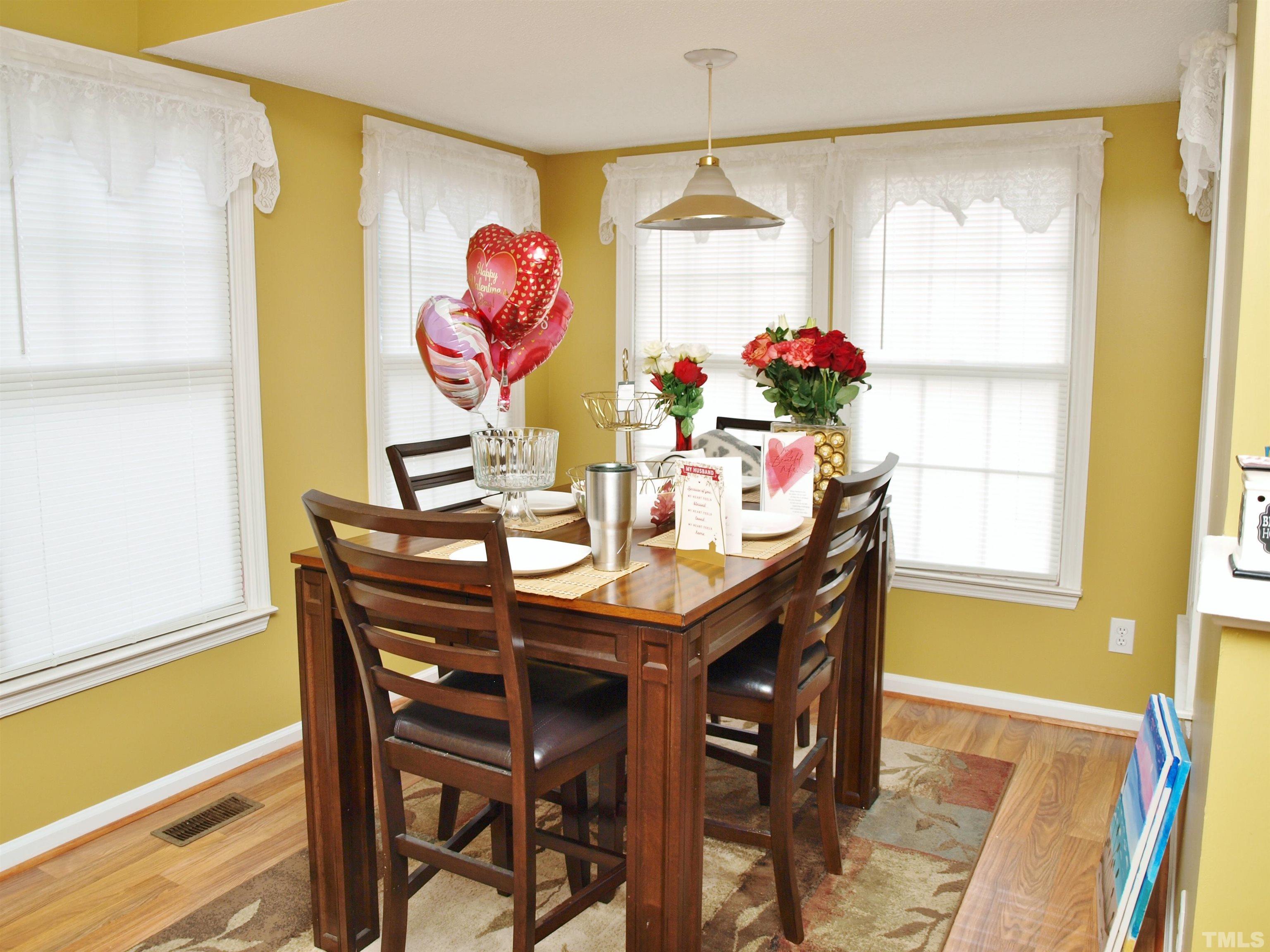 4621 Fox Road Raleigh, NC 27616 - Photo 3 of 14 a view of a dining room with furniture and chandelier