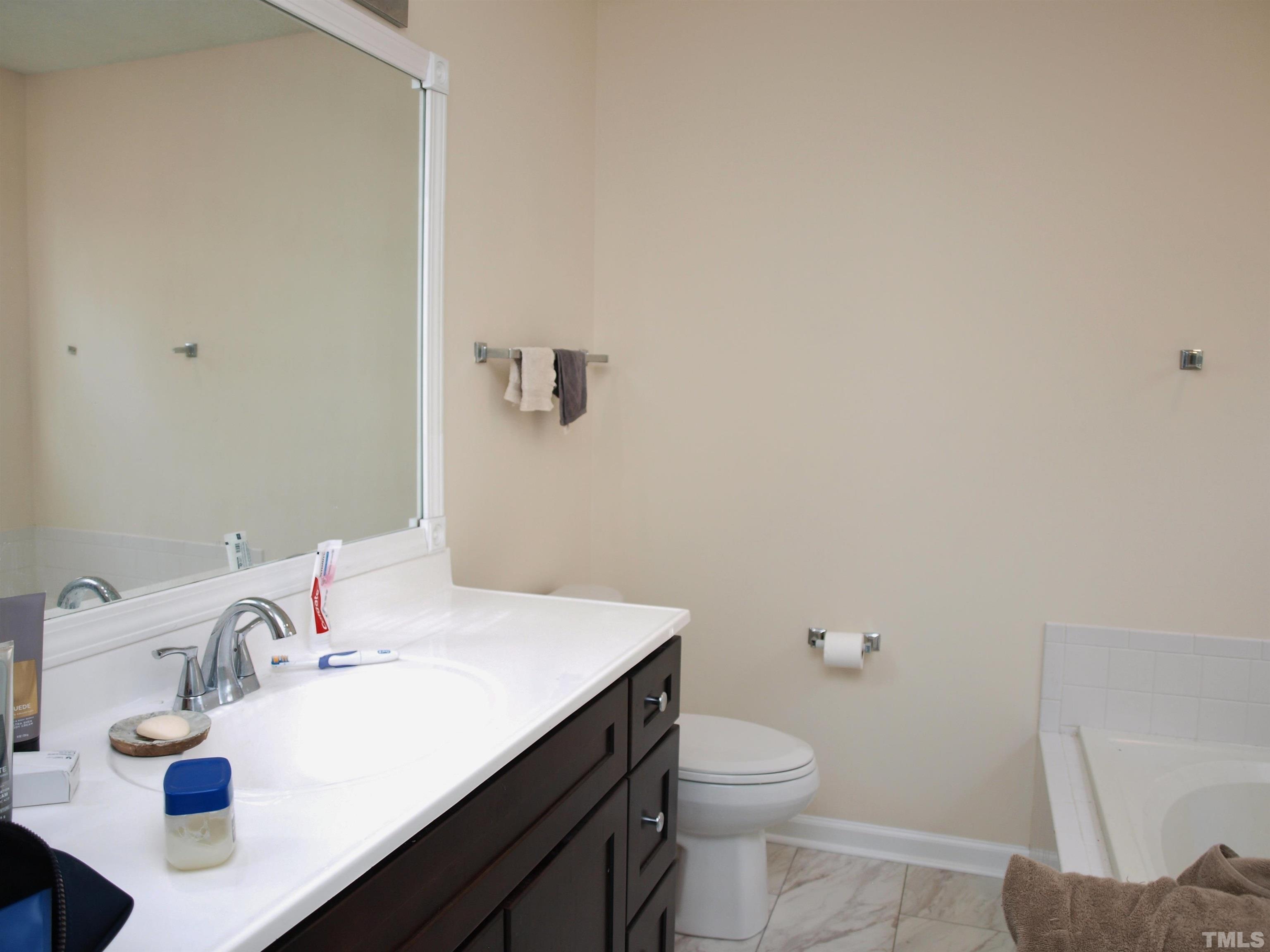 4621 Fox Road Raleigh, NC 27616 - Photo 8 of 14 a bathroom with a sink and a toilet
