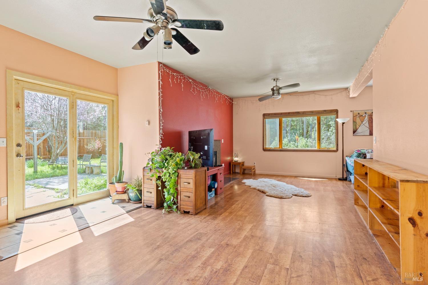 a view of an entryway with wooden floor and windows