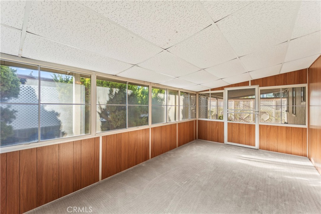 24001 Muirlands Boulevard, Unit 81 Lake Forest, CA 92630 - Photo 20 of 24 Enclosed porch leading to the beautiful outdoor patio.