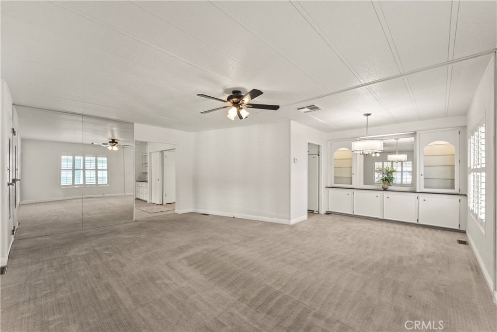 24001 Muirlands Boulevard, Unit 81 Lake Forest, CA 92630 - Photo 6 of 24 Living room + Dining