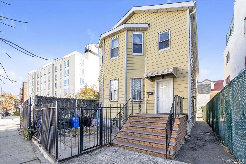 111-24 Northern Boulevard Queens, NY 11368 - Photo 1 of 1 a view of a house with wooden fence