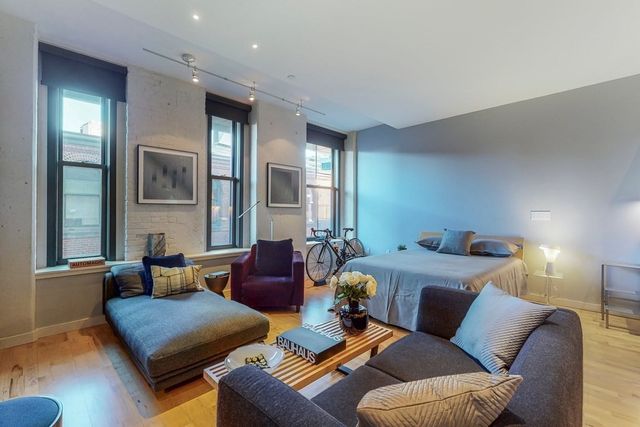 a bedroom with furniture and a view of bedroom