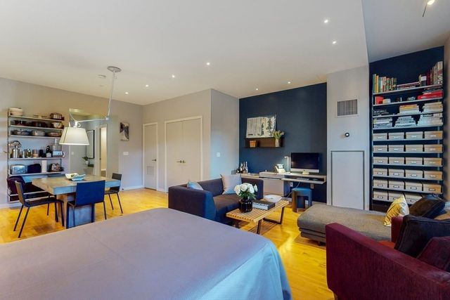 a kitchen with a table and chairs in it