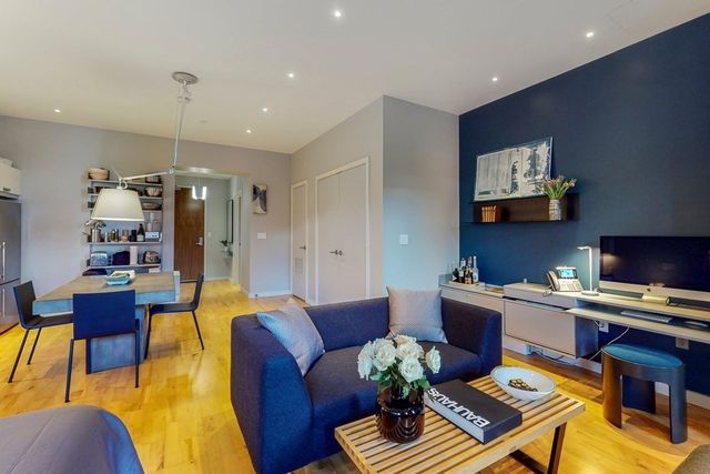 a view of a kitchen with dining table and chairs