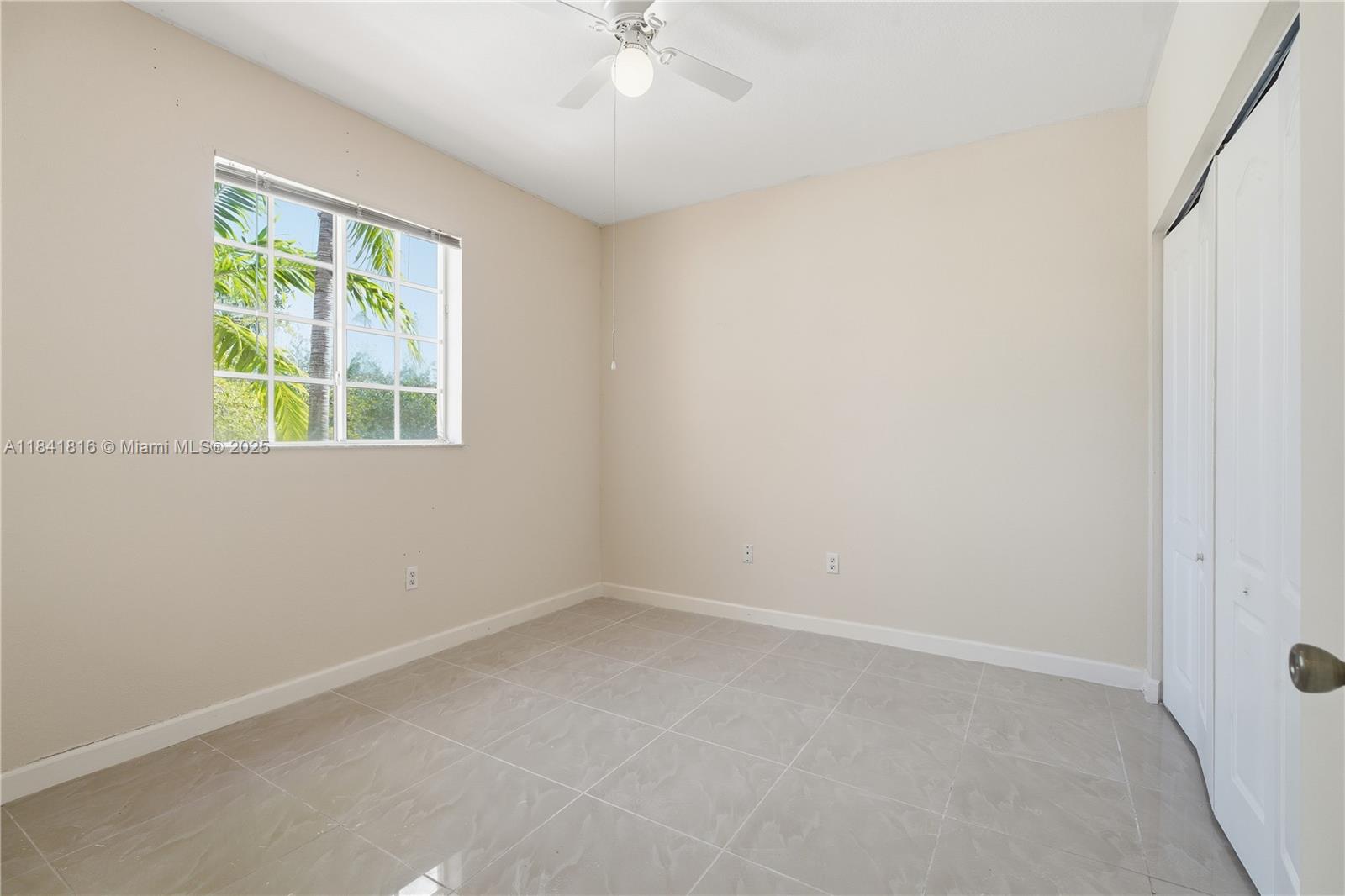 21460 Southwest 85th Passage Cutler Bay, FL 33189 - Photo 11 of 20 an empty room with a window