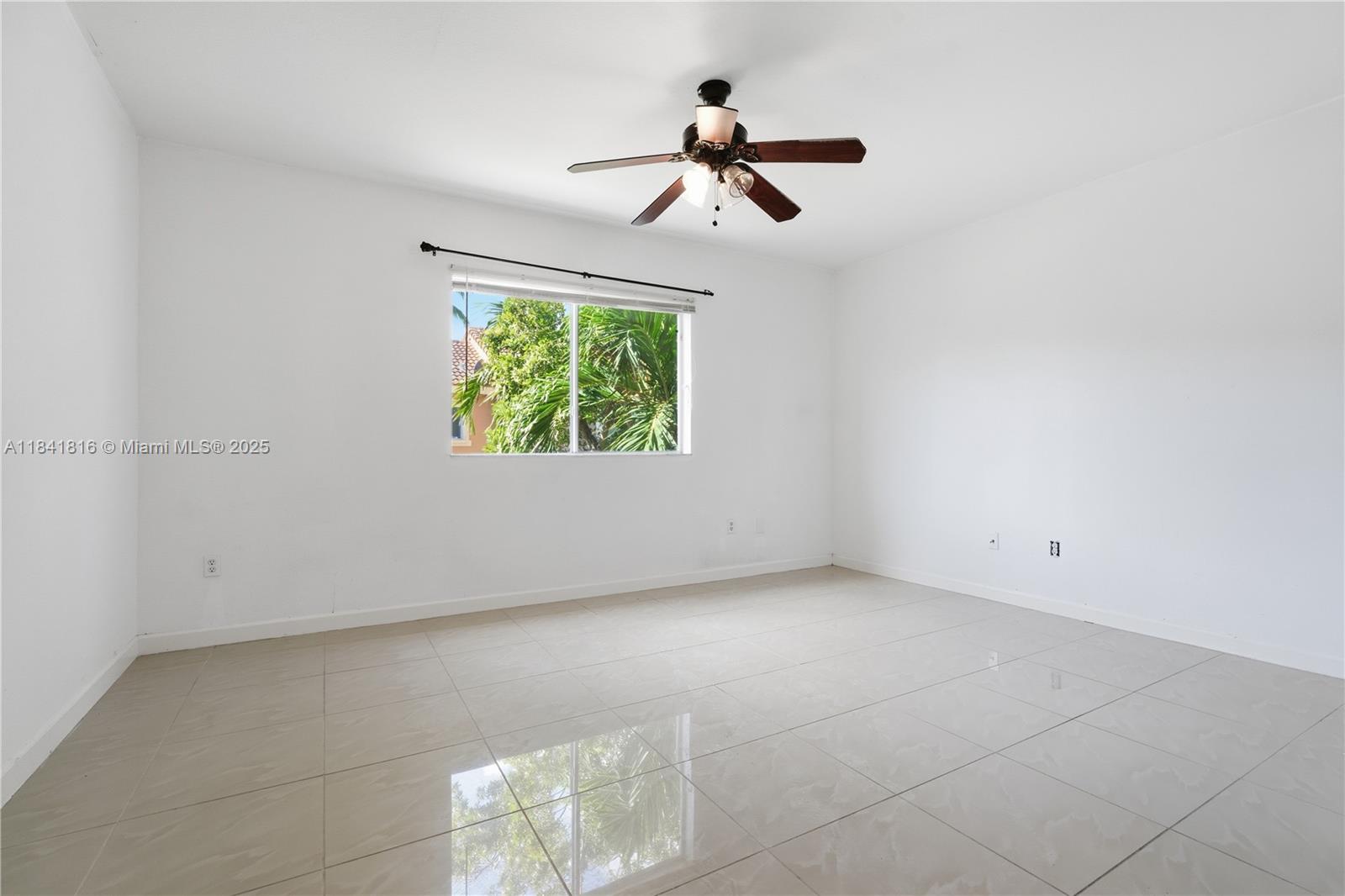 21460 Southwest 85th Passage Cutler Bay, FL 33189 - Photo 15 of 20 an empty room with windows and fan