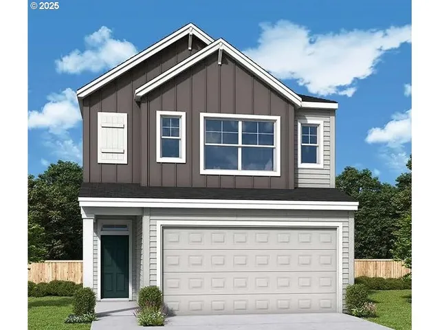 a front view of a house with garage