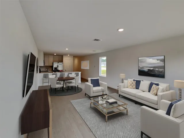a living room with furniture couches and a flat screen tv