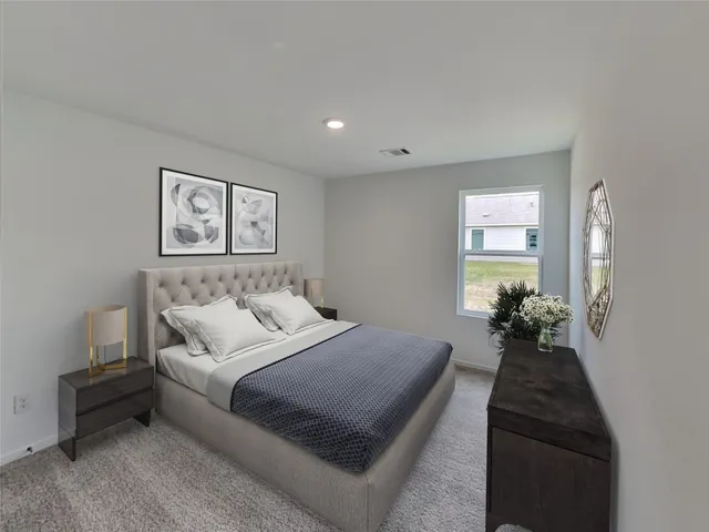 a bedroom with a bed and glass walk in closet