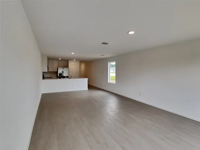 a view of a kitchen and a window in a room