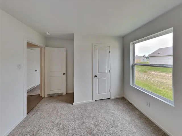 a view of an empty room and window