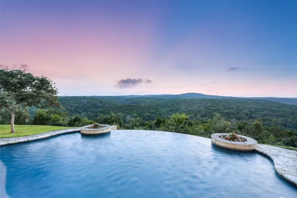 a view of swimming pool with a yard