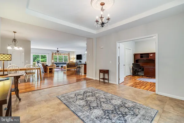 a kitchen with a table and chairs in it