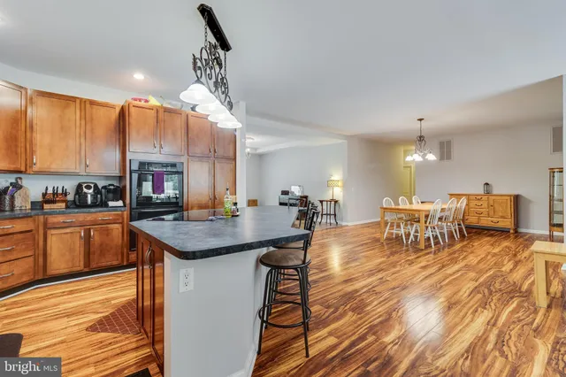 a living room with furniture a rug and a large window