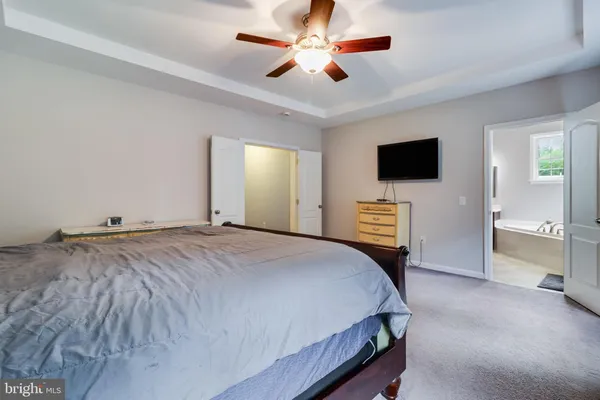 a view of empty room with ceiling fan