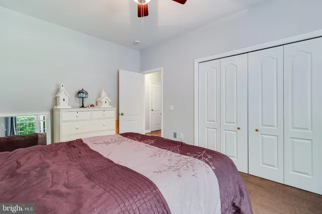 a bathroom with a sink vanity and a toilet