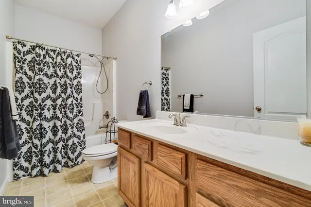 a picture of a wall with a white wall and a white refrigerator