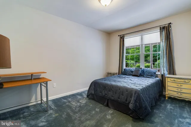 a view of a storage and utility room with wooden floor
