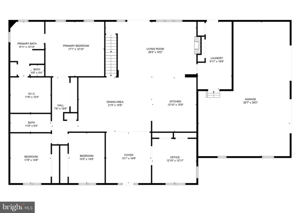 a front view of house with yard and trees in the background