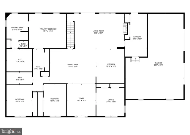 a front view of house with yard and trees in the background