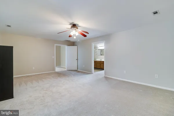 a view of backyard with plants and outdoor seating