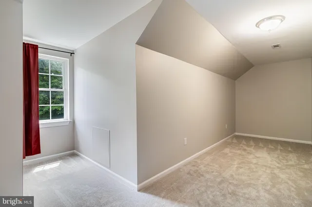 a view of balcony with wooden floor and seating space