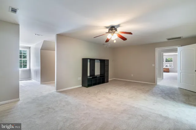 an aerial view of a house with a yard and garden