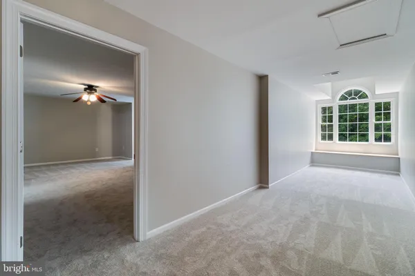 an aerial view of a house with a yard and garden